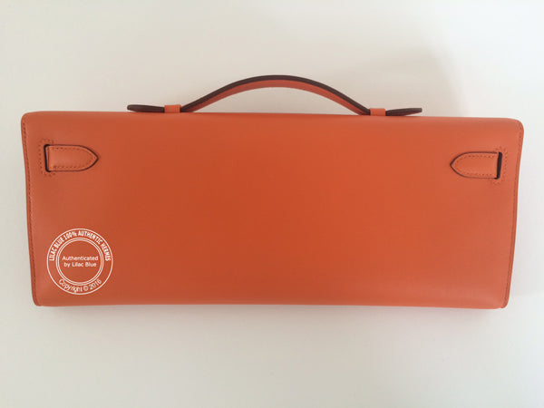 Hermès Kelly 31cm Orange Cut Pochette Swift PHW