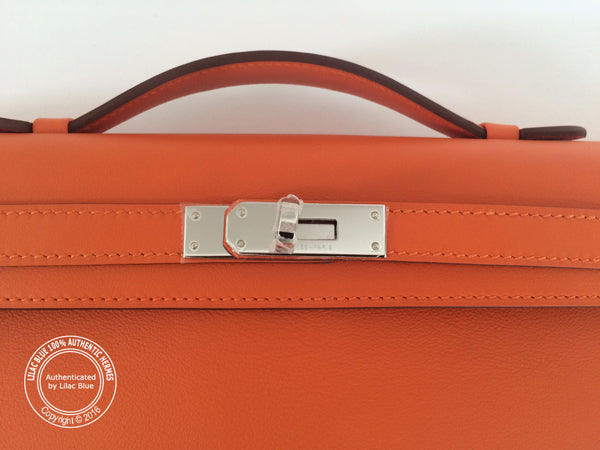 Hermès Kelly 31cm Orange Cut Pochette Swift PHW