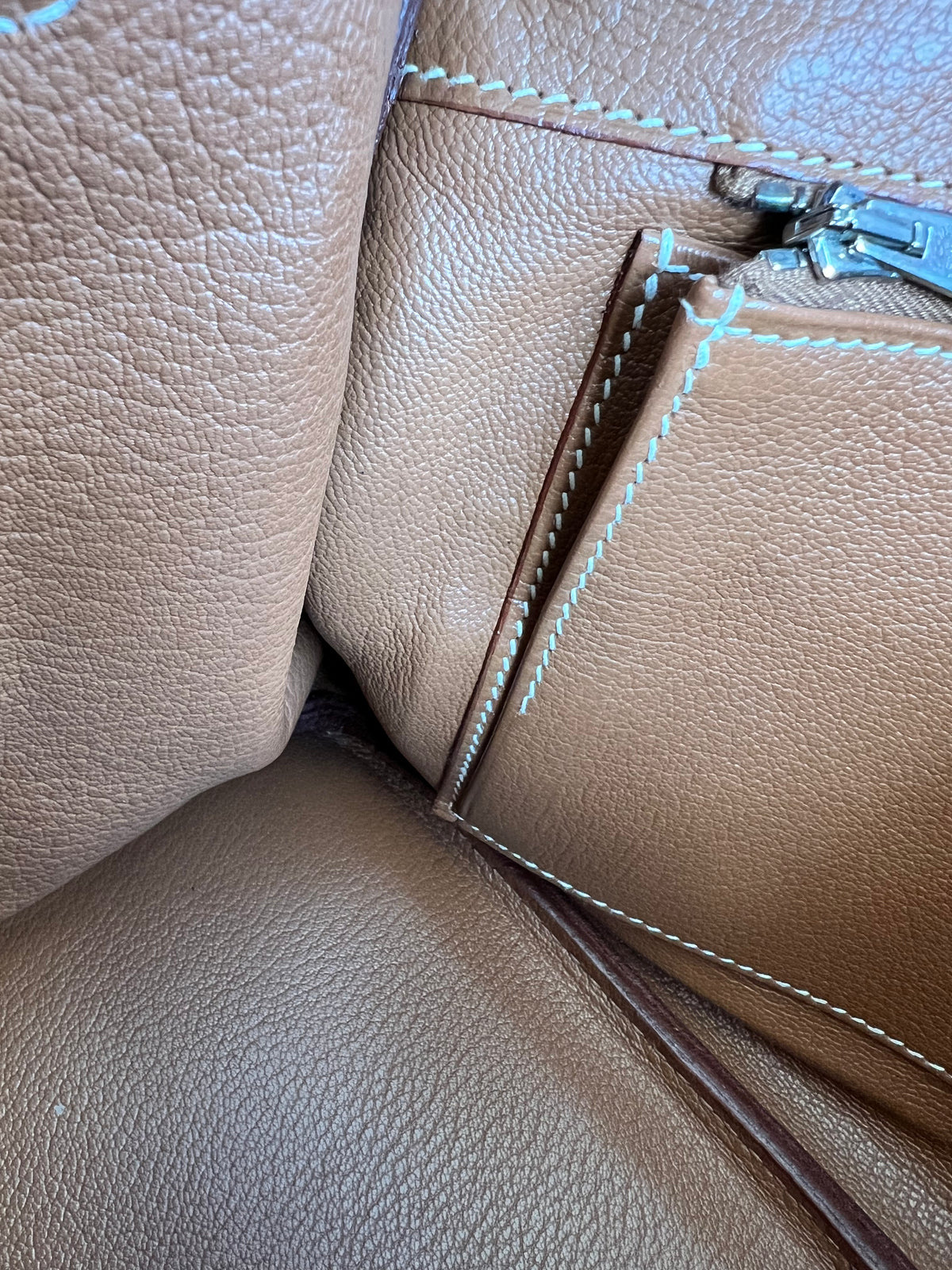Stitching under the zip pocket